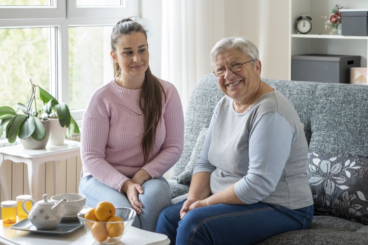 Adult granddaughter and grandmother exploring assisted living facility options