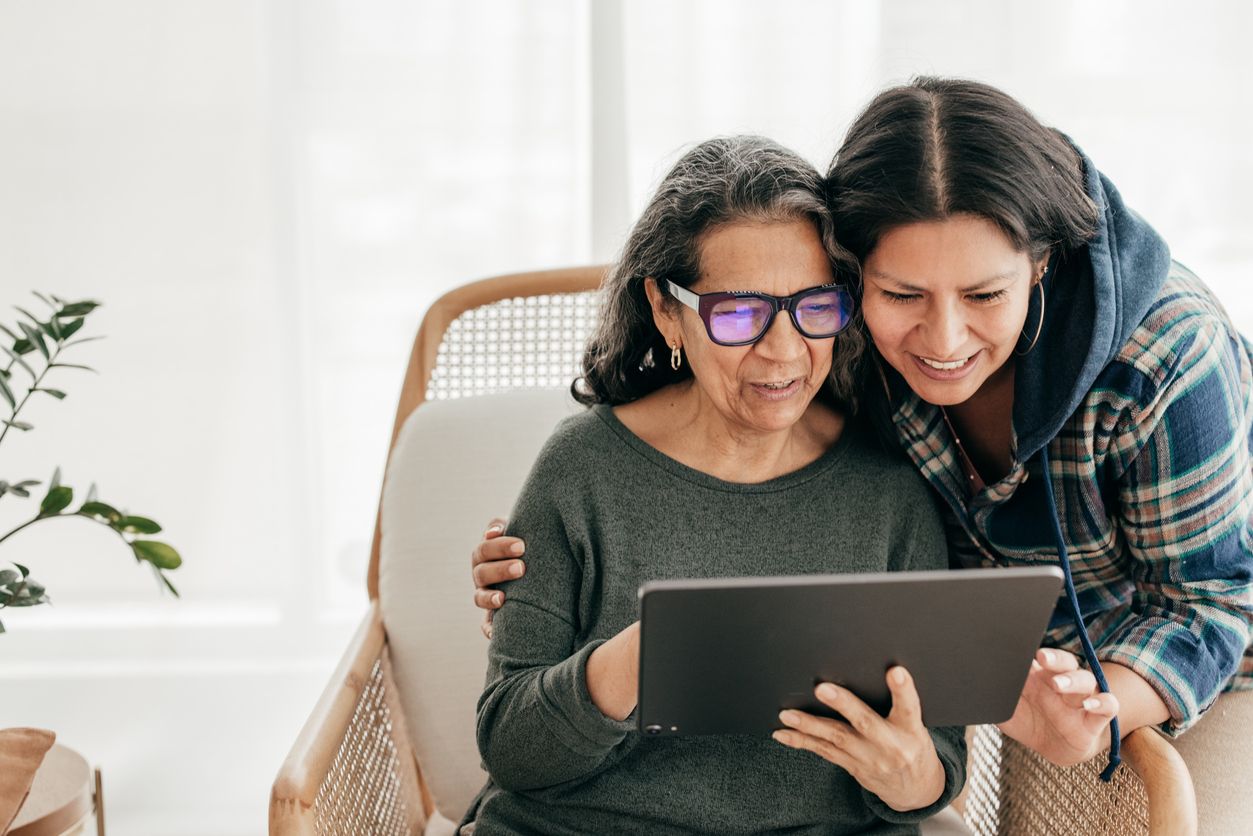 Adult daughter researching assisted care facilities to find a place for mom